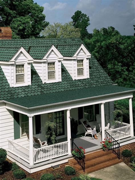 green house with metal roofs|farmhouse with green metal roof.